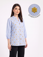 itna nahi 4 line jitna A fresh sky blue top featuring delicate mustard floral embroidery for a subtle contrast. The split neckline, front button detailing, and 3/4 gathered sleeves give it a polished yet easy look.