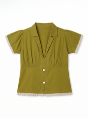 An olive green short-sleeve blouse with cream-colored ruffled trim on the sleeve cuffs, button placket, and hem, displayed flat against a white background.