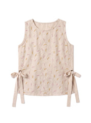 A sleeveless beige linen vest featuring a delicate pattern of small pink and gold leaves, with side tie details at the waist, shown against a plain white background.