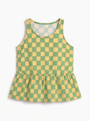 A sleeveless children's top with a green and yellow checkered pattern and a gathered peplum hem, displayed on a clean white background.