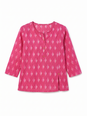 A pink long-sleeve top with a white ikat pattern, featuring a buttoned round neckline and a split hem, shown on a plain white background.