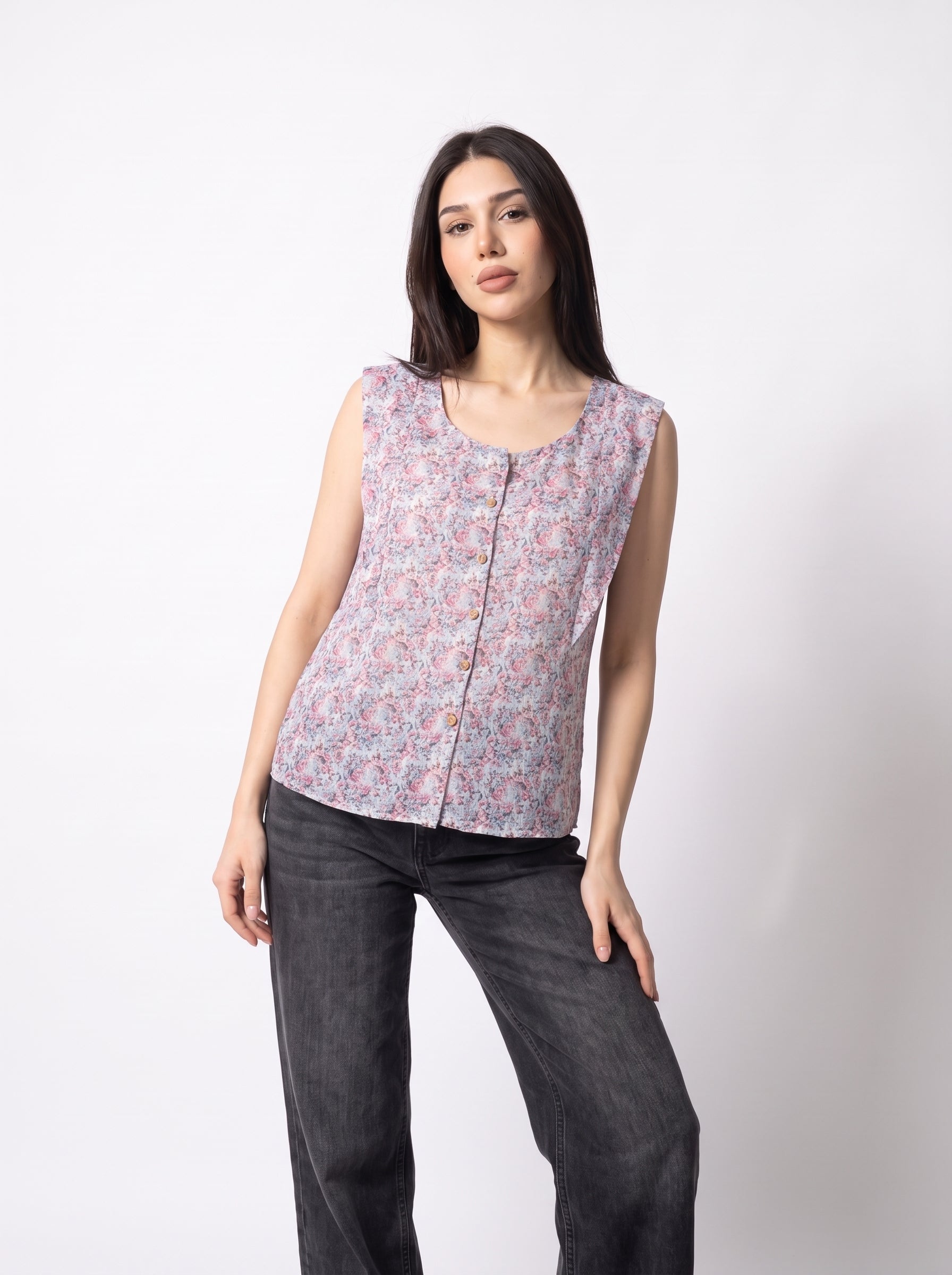 A soft lavender sleeveless top featuring delicate pink and blue mini florals for a fresh feminine look.