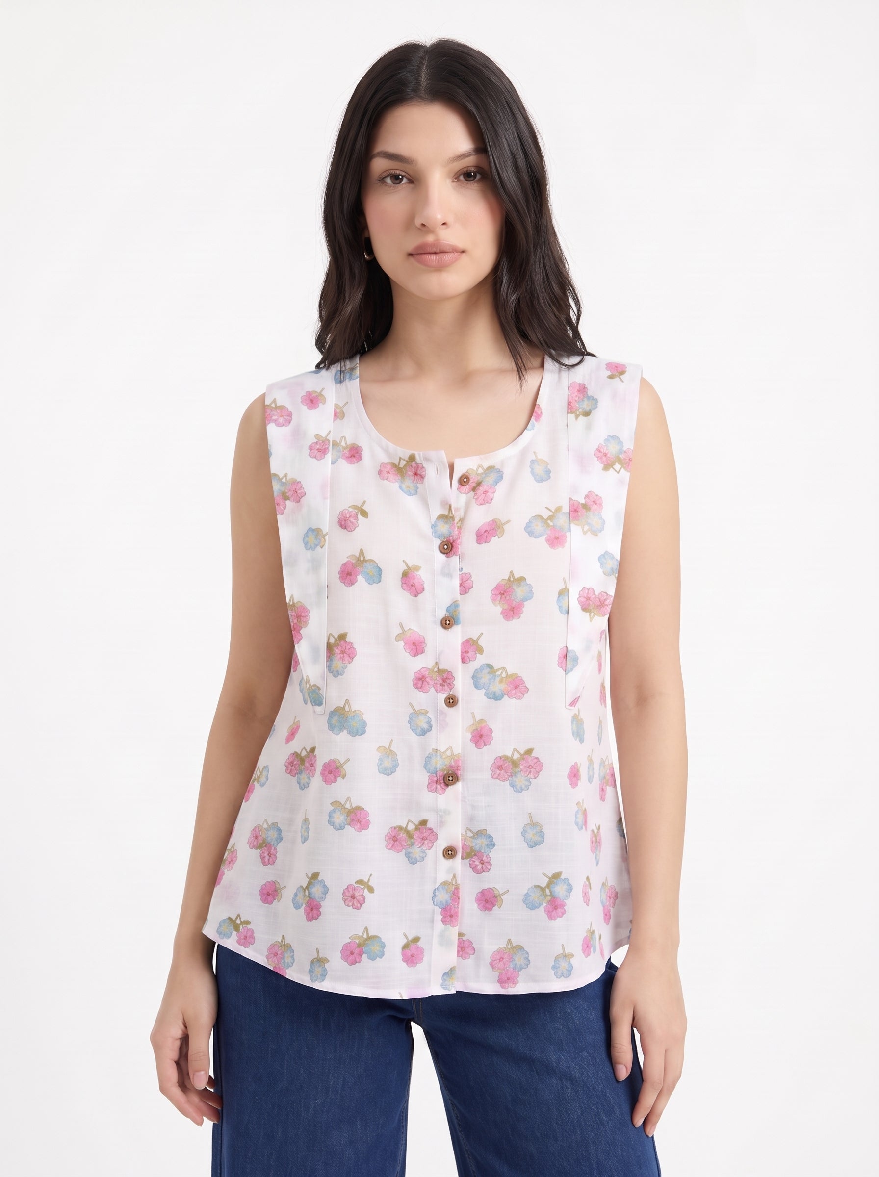 A fresh off-white sleeveless top featuring delicate pink and blue floral clusters for a soft feminine look.