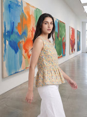 A fresh Multicolor sleeveless top featuring colorful geometric triangle motifs in blue, red, green, and orange tones.