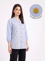 itna nahi 4 line jitna A fresh sky blue top featuring delicate mustard floral embroidery for a subtle contrast. The split neckline, front button detailing, and 3/4 gathered sleeves give it a polished yet easy look.