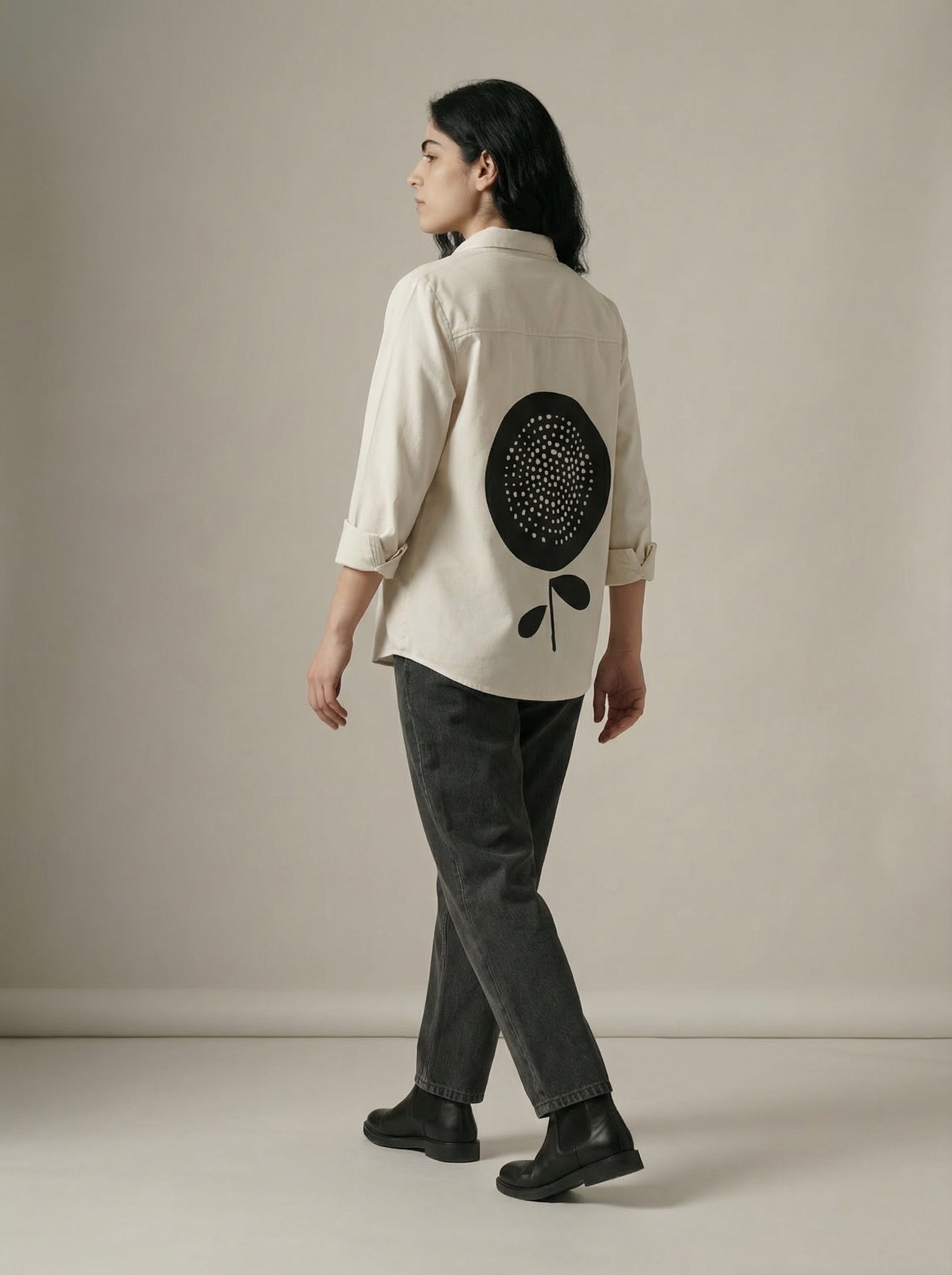 A timeless cream shirt top featuring a clean button-down front and classic collar for a refined, versatile look.