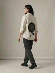 A timeless cream shirt top featuring a clean button-down front and classic collar for a refined, versatile look.