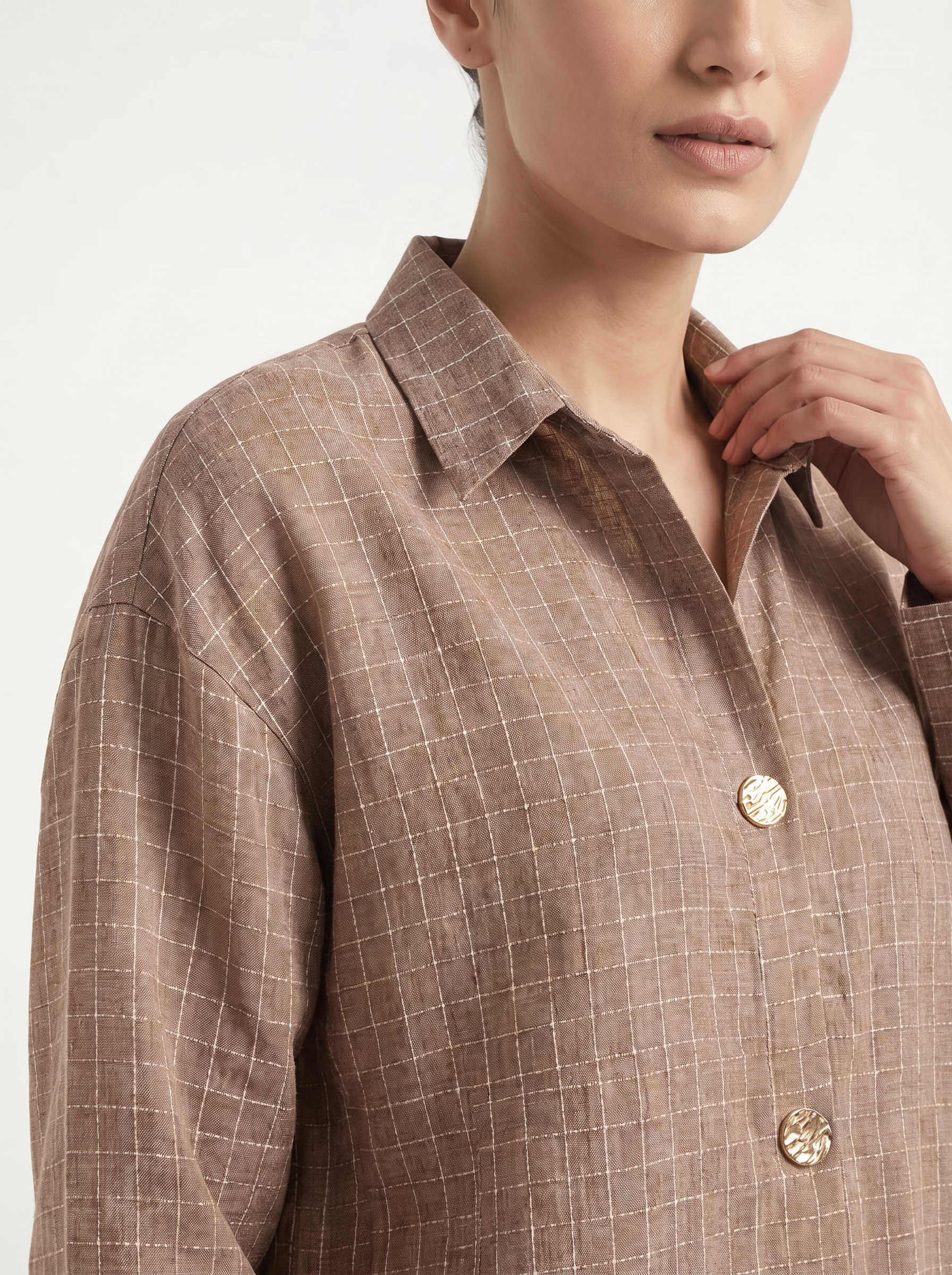 A refined mocha taupe shirt top featuring a subtle windowpane check pattern for a smart, modern look. The classic collar and gold-tone statement buttons add a polished touch, while the relaxed silhouette keeps it comfortable and easy to wear