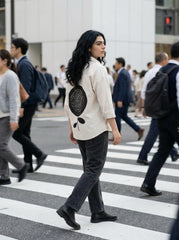 A timeless cream shirt top featuring a clean button-down front and classic collar for a refined, versatile look.