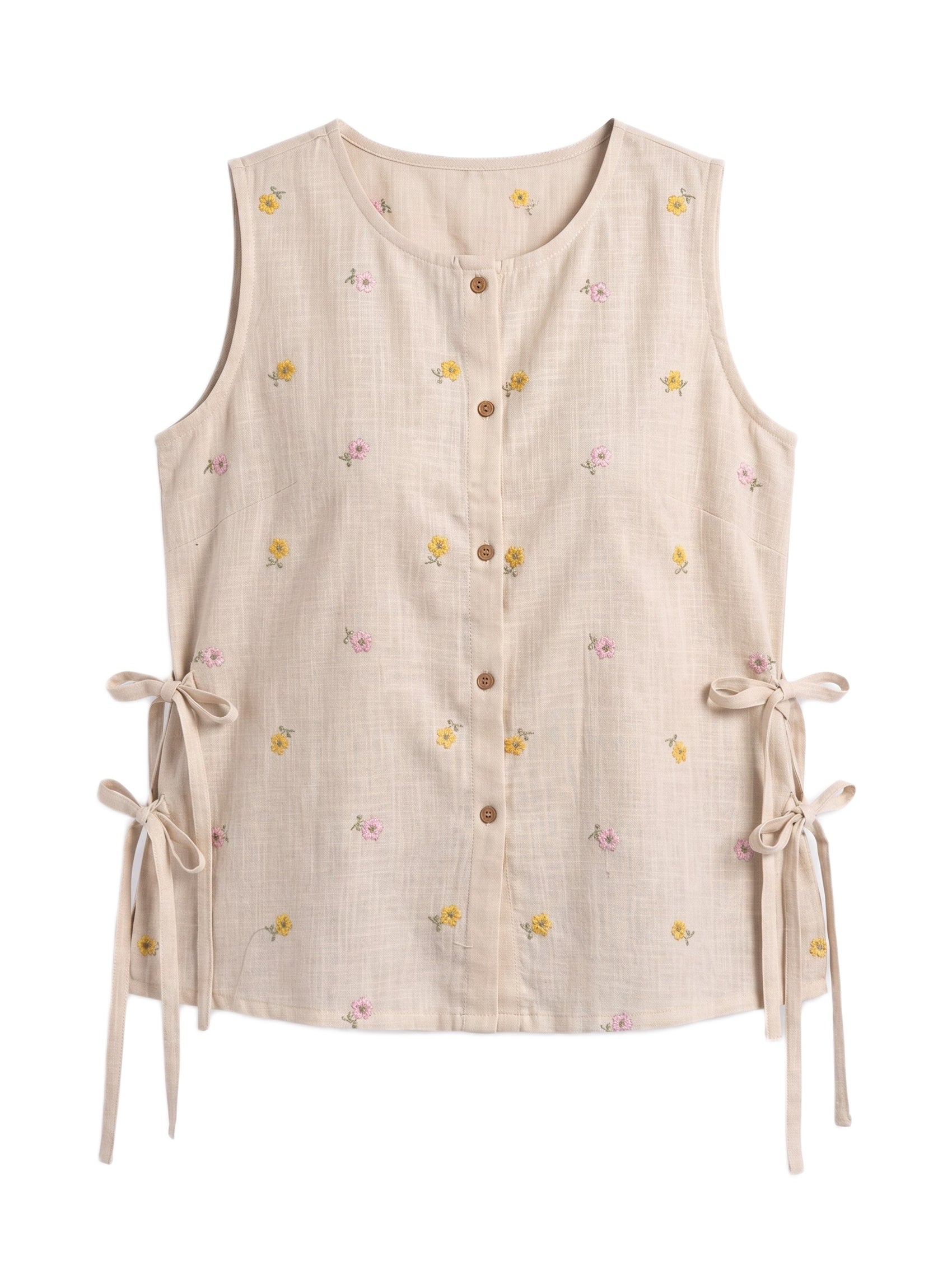 A sleeveless beige linen vest with a small yellow and pink floral print, brown button-down front, and side tie details, shown on a plain white background.