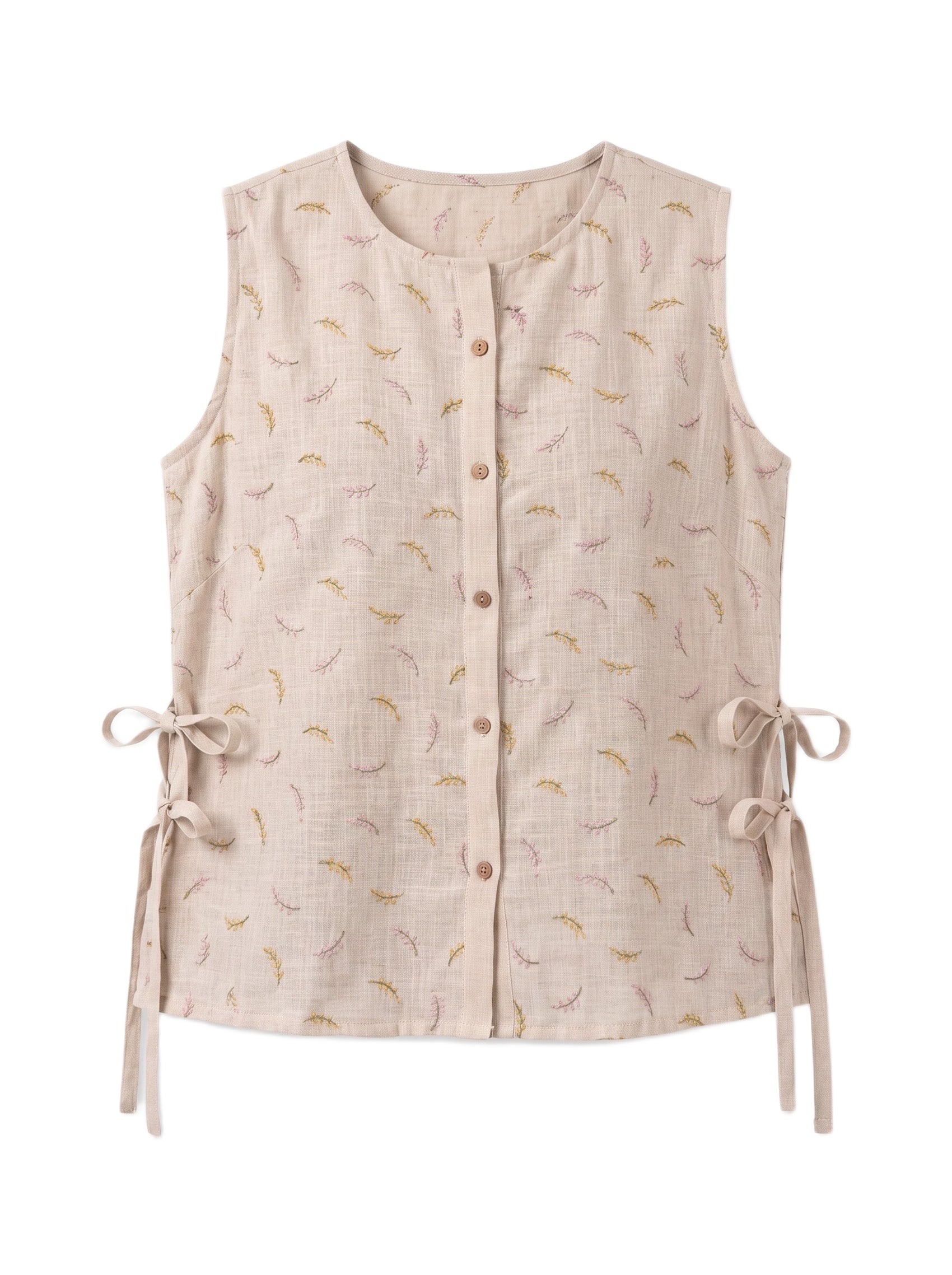 A sleeveless beige linen vest featuring a delicate yellow and pink leaf pattern, a button-up front, and side tie details, shown against a plain white background.