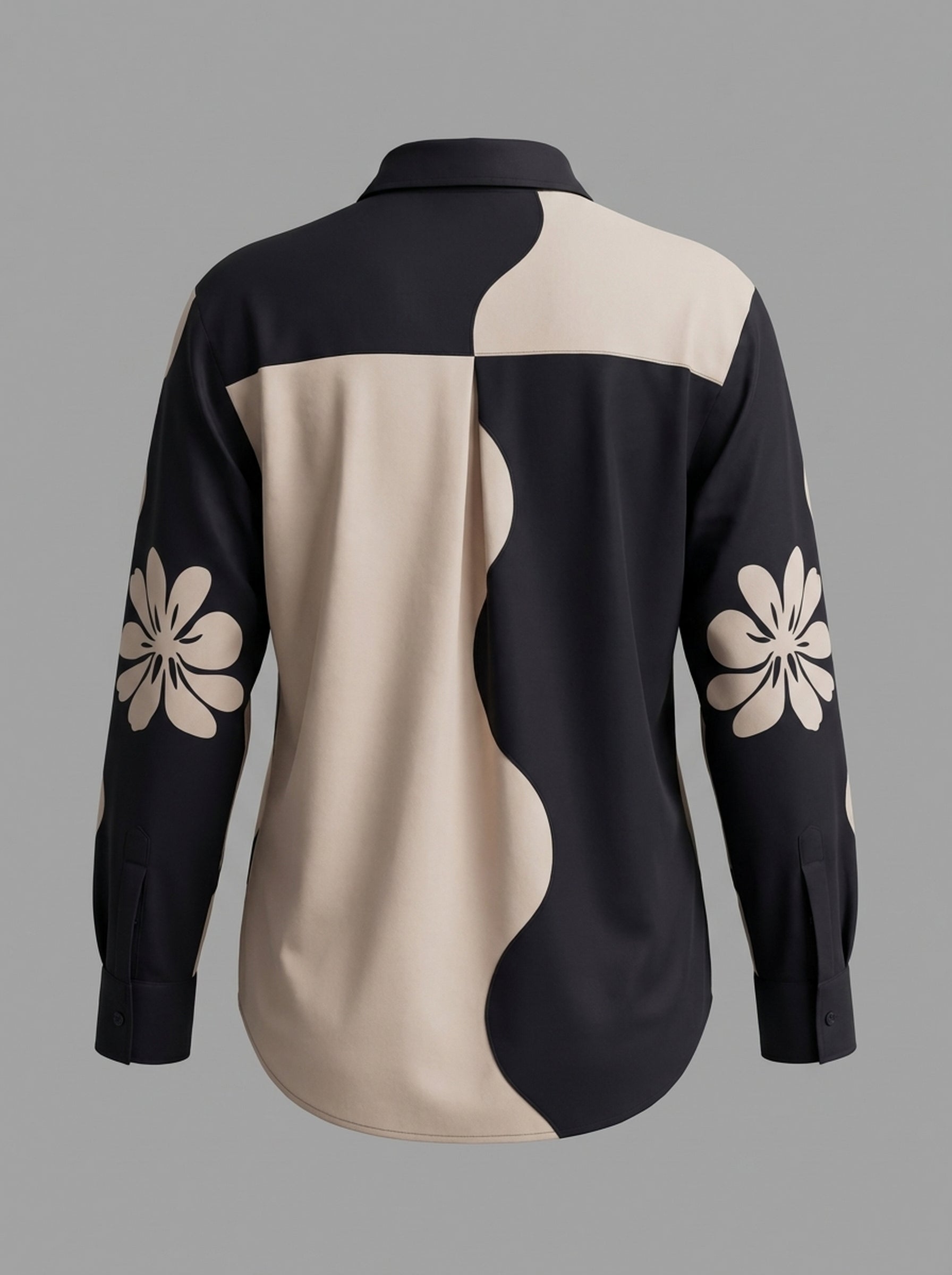 A contemporary beige and black shirt top featuring a striking asymmetric colorblock design with bold floral graphics for a distinctive modern look