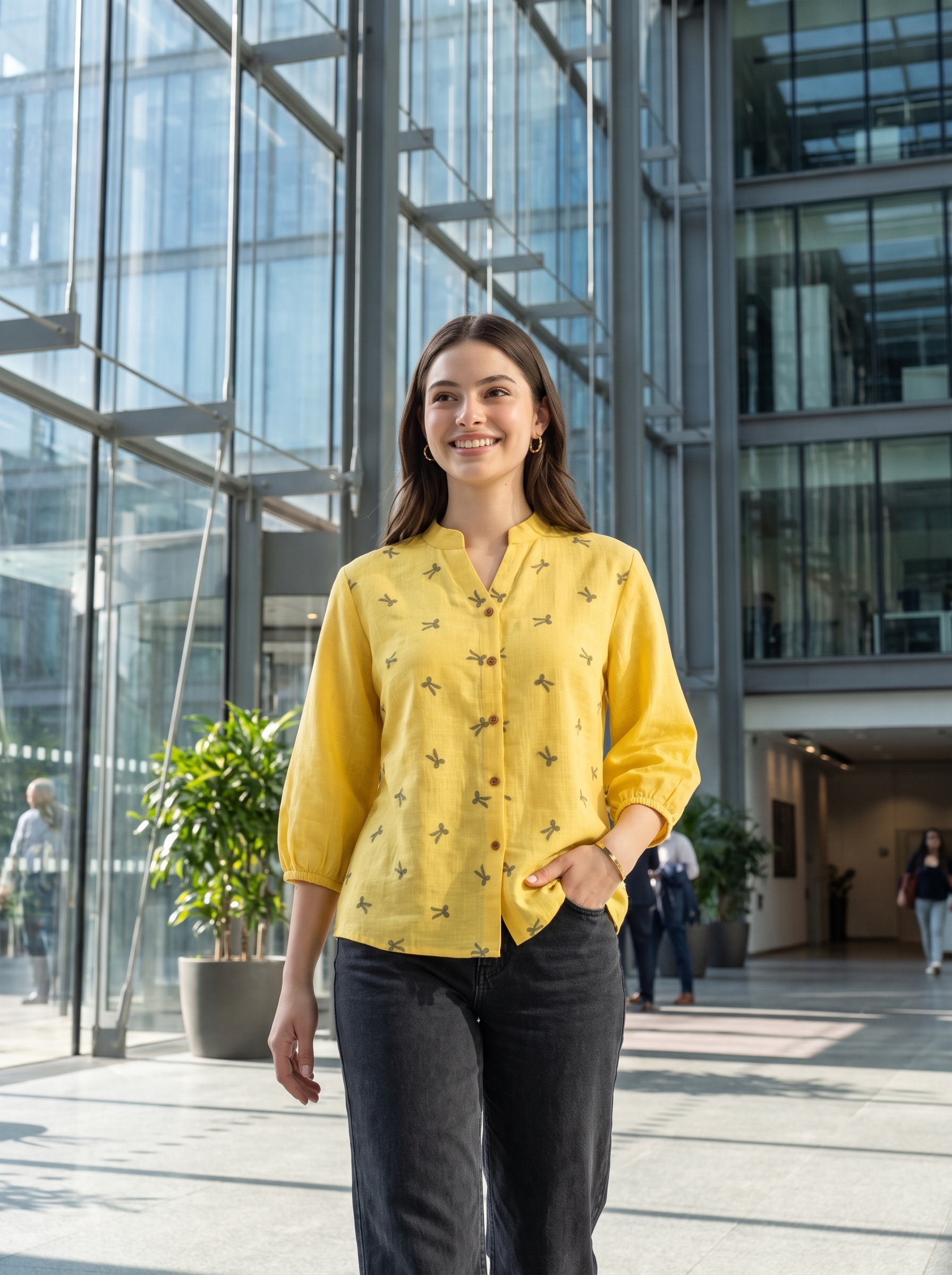 Bright and cheerful, this sunshine yellow top features delicate olive bow-motif embroidery scattered across the front. The split neckline, button-front detailing, and 3/4 gathered sleeves create a neat yet relaxed look.