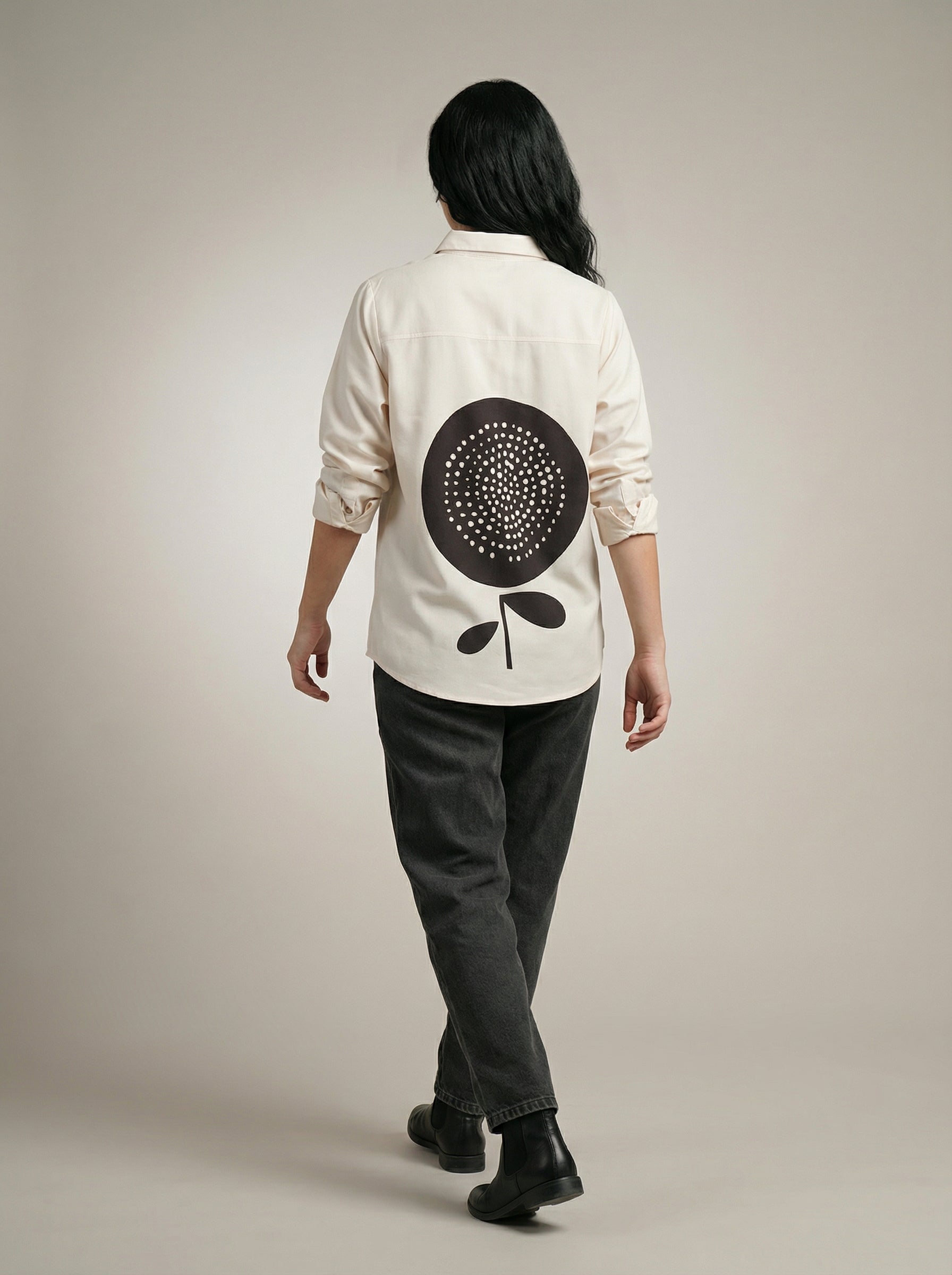 A timeless cream shirt top featuring a clean button-down front and classic collar for a refined, versatile look.
