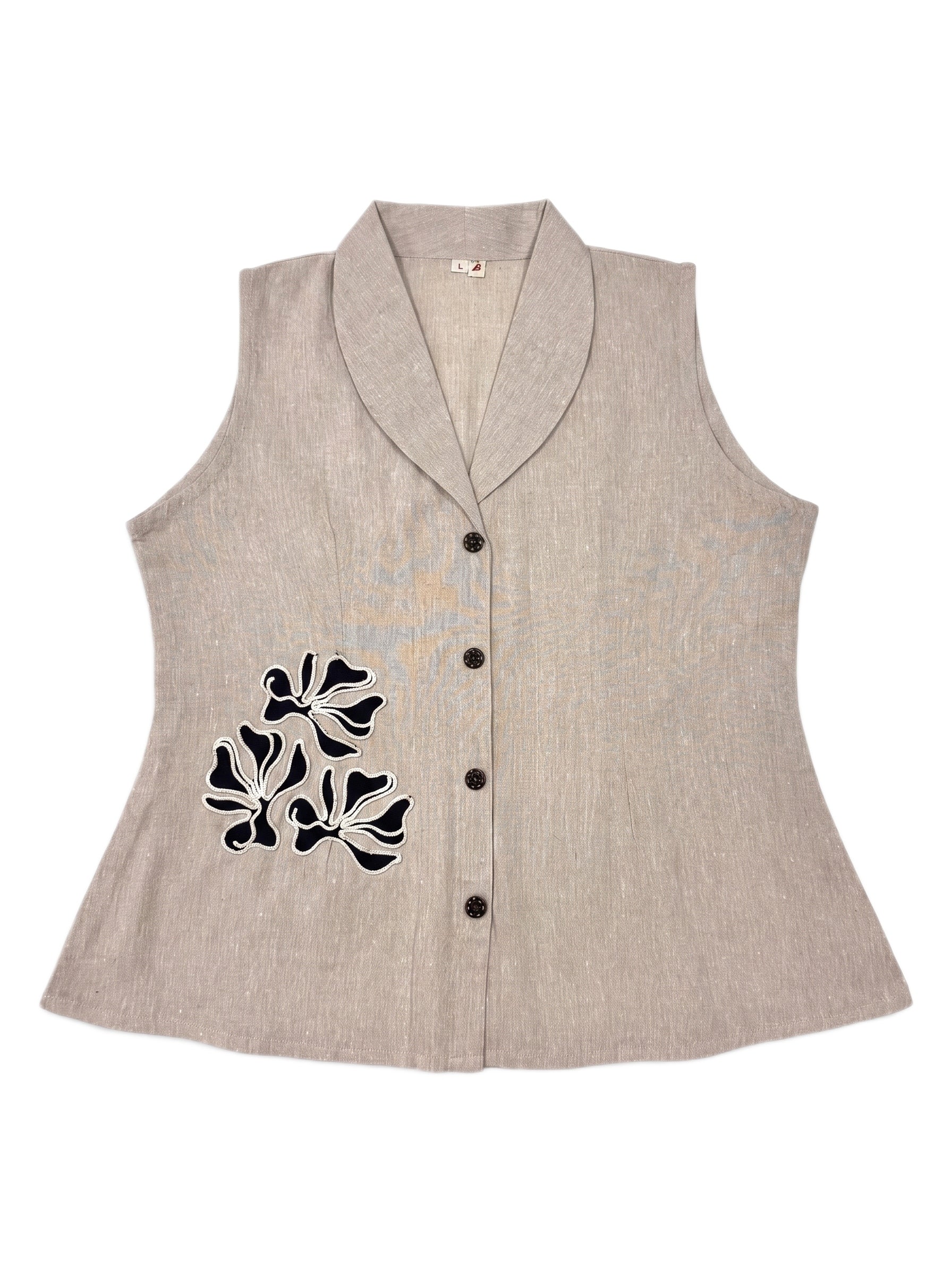 A sleeveless beige linen vest with a shawl collar, black buttons, and black floral embroidery on the front, displayed against a white background.
