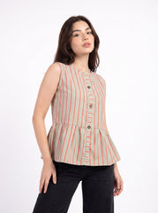 A woman modeling a sleeveless peplum top with vertical stripes in beige, orange, and green, paired with black pants, against a plain white background.