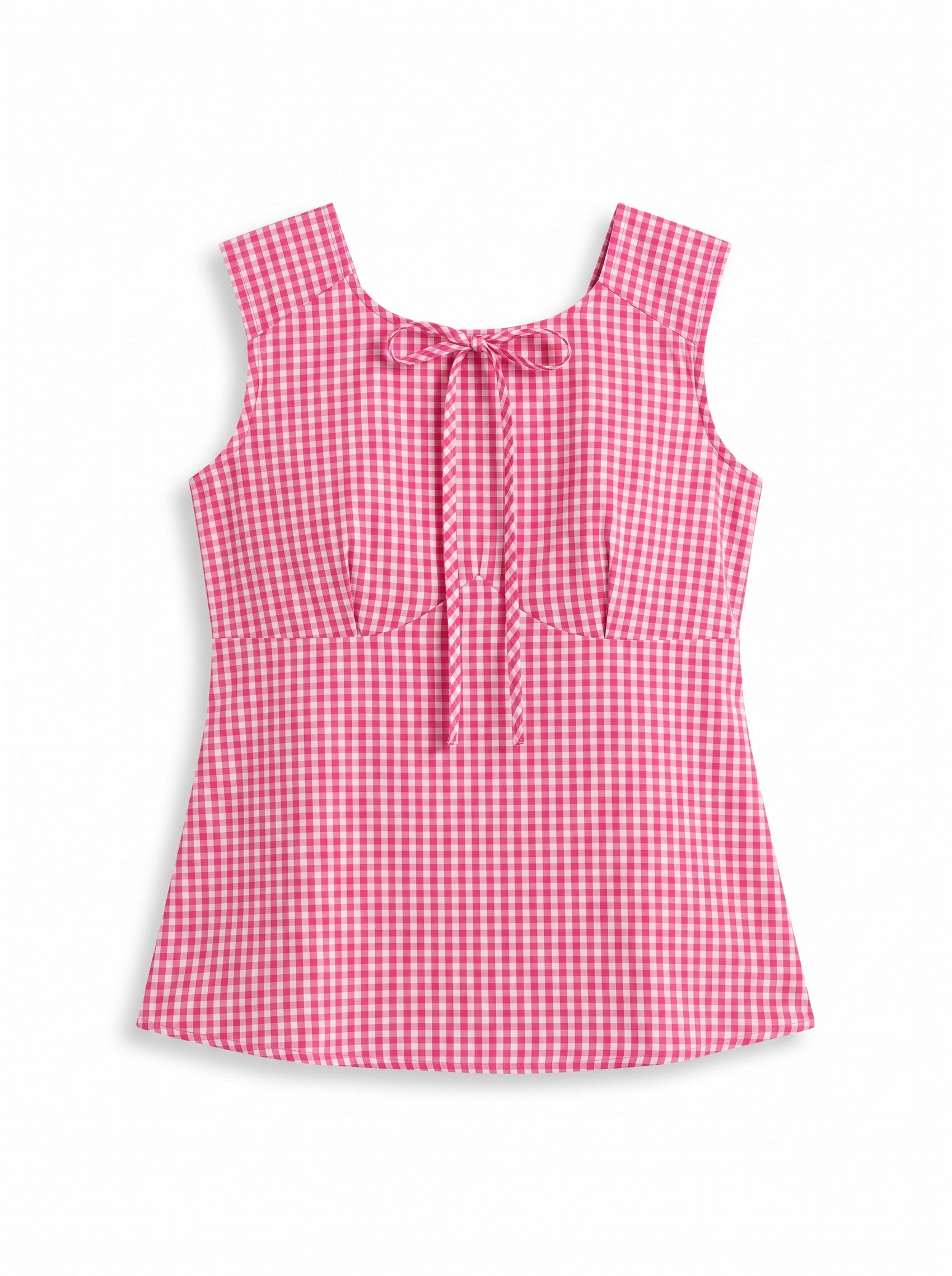 A woman modeling a sleeveless pink and white gingham top with a tie-neck detail, paired with dark gray jeans, against a plain white studio background.