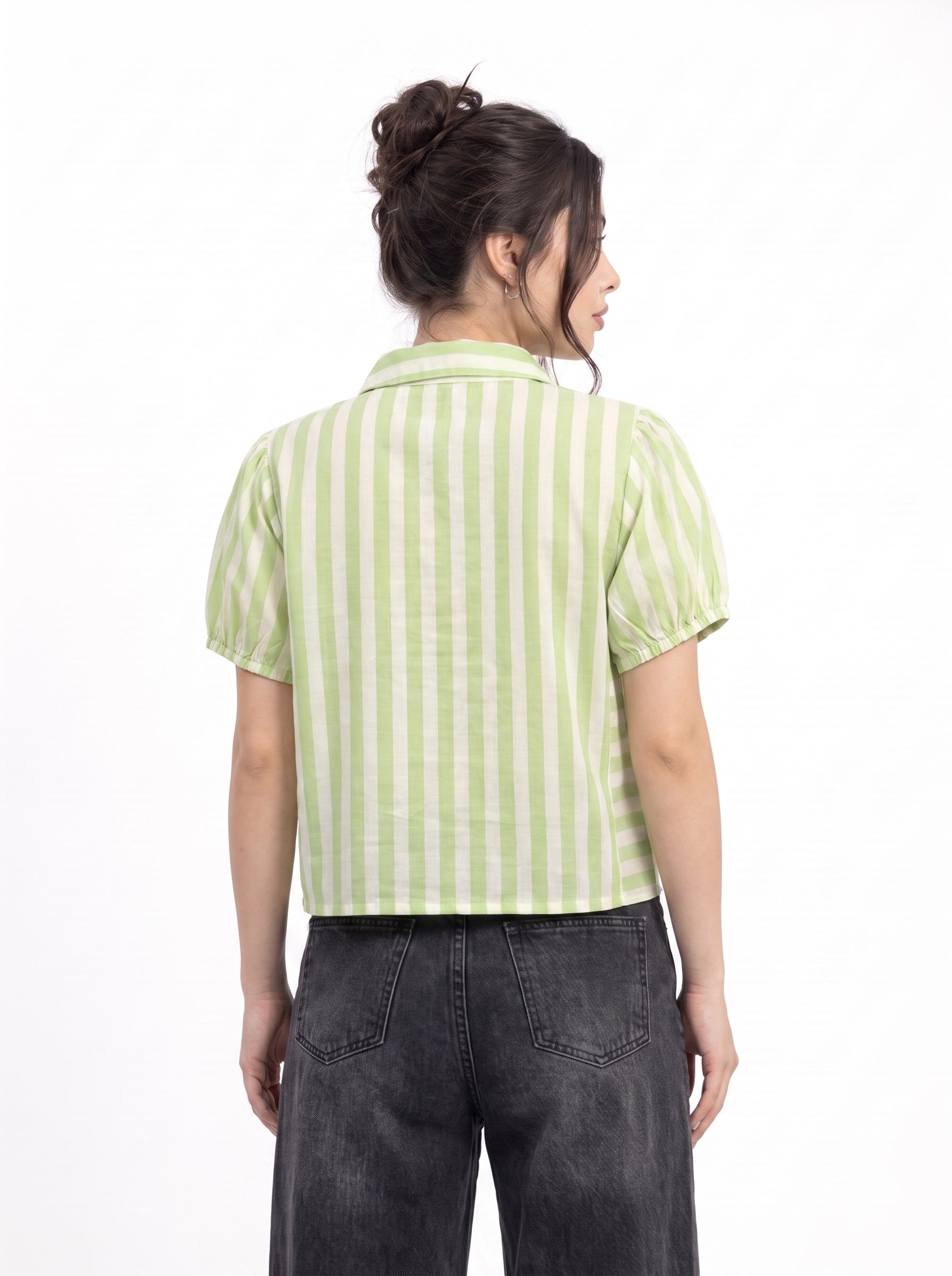 A woman shown from the back wearing a light green and white vertically striped short-sleeve cropped shirt with dark gray jeans, against a plain white background.