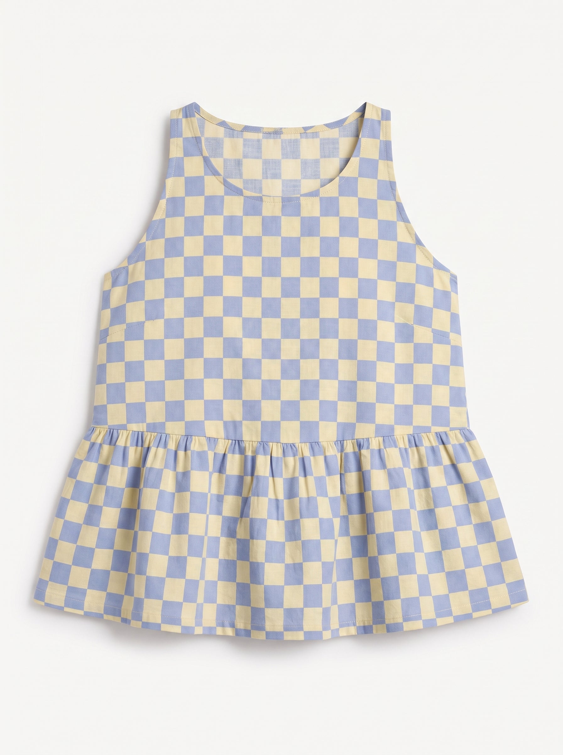 A sleeveless children's top with a light blue and cream checkerboard pattern and a gathered ruffle hem, shown flat against a light background.