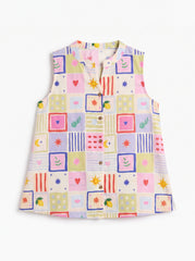 A sleeveless children's top with a colorful patchwork print of squares and small motifs, featuring a split neckline and button details, shown on a plain white background.