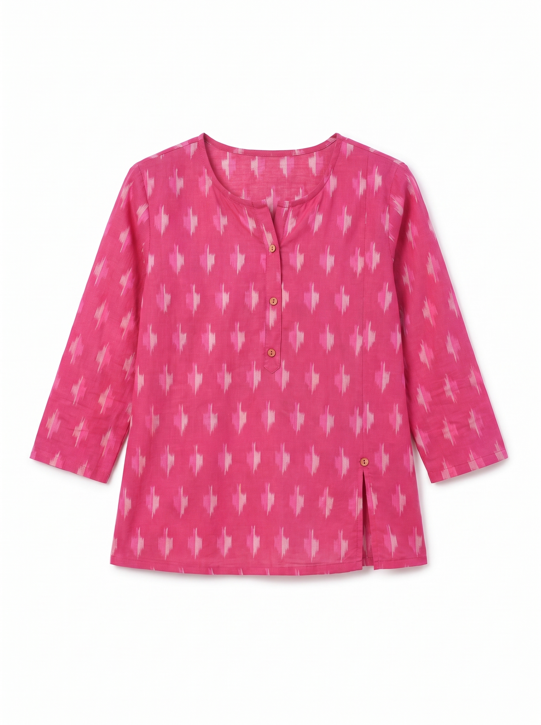 A pink long-sleeve top with a white ikat pattern, featuring a buttoned round neckline and a split hem, shown on a plain white background.