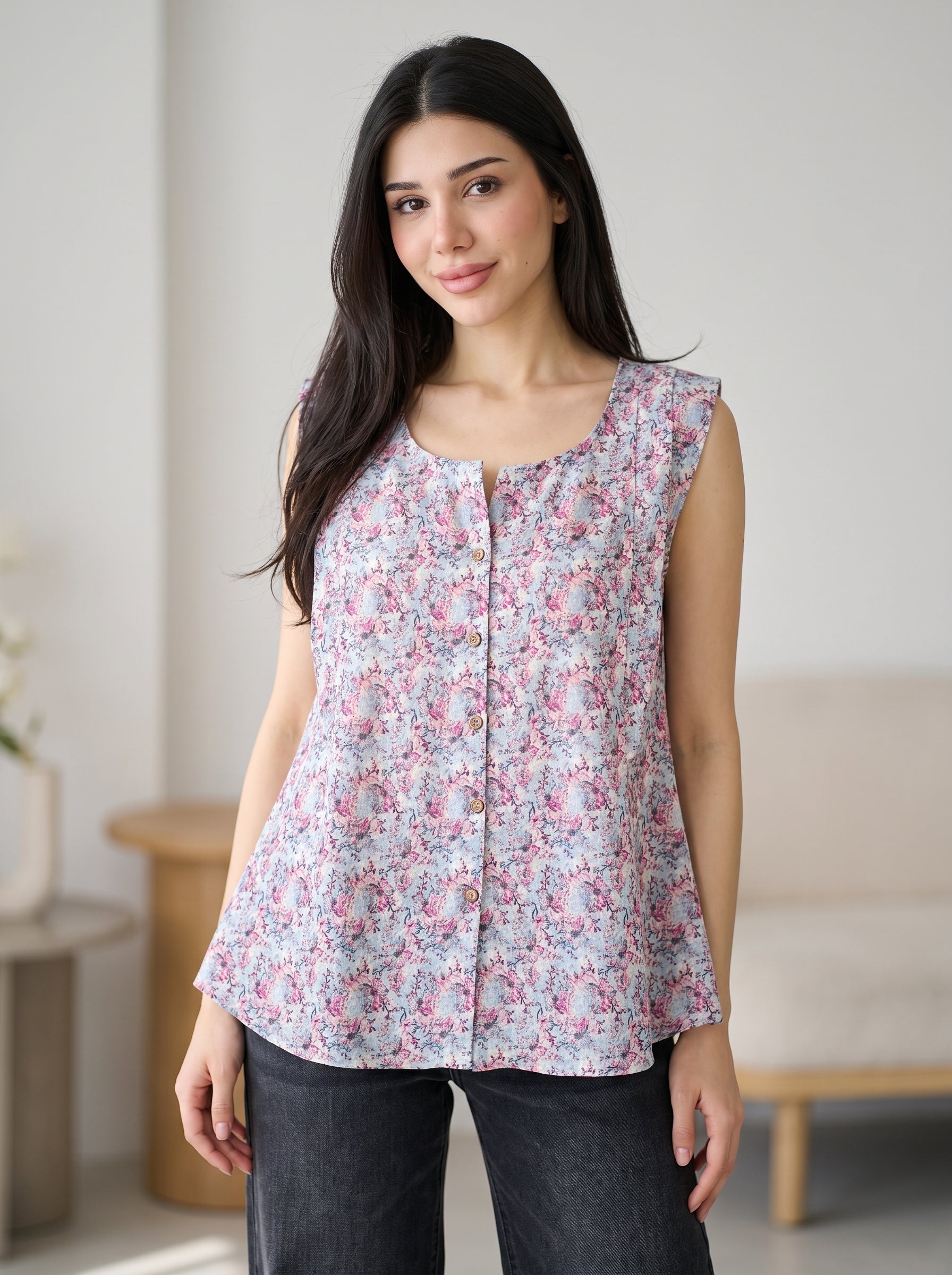 A soft lavender sleeveless top featuring delicate pink and blue mini florals for a fresh feminine look.