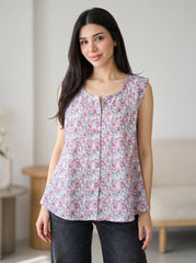 A soft lavender sleeveless top featuring delicate pink and blue mini florals for a fresh feminine look.