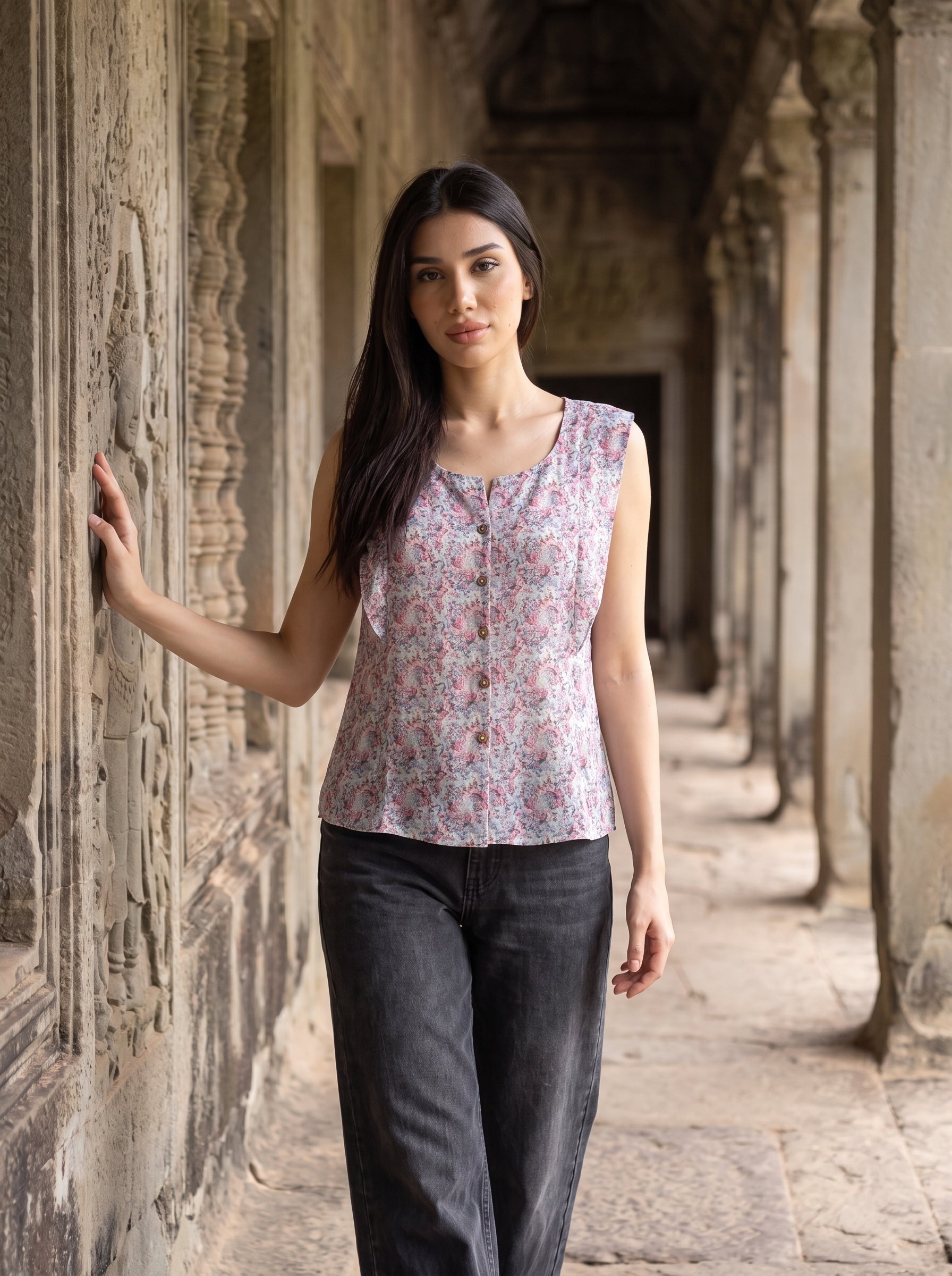 A soft lavender sleeveless top featuring delicate pink and blue mini florals for a fresh feminine look.