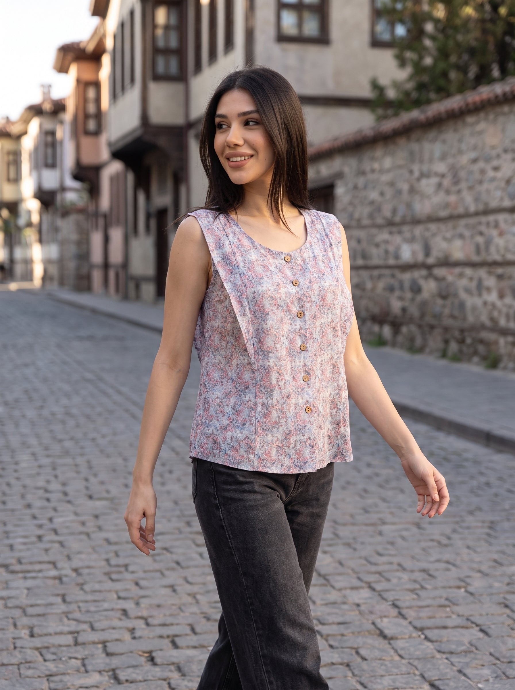 A soft lavender sleeveless top featuring delicate pink and blue mini florals for a fresh feminine look.