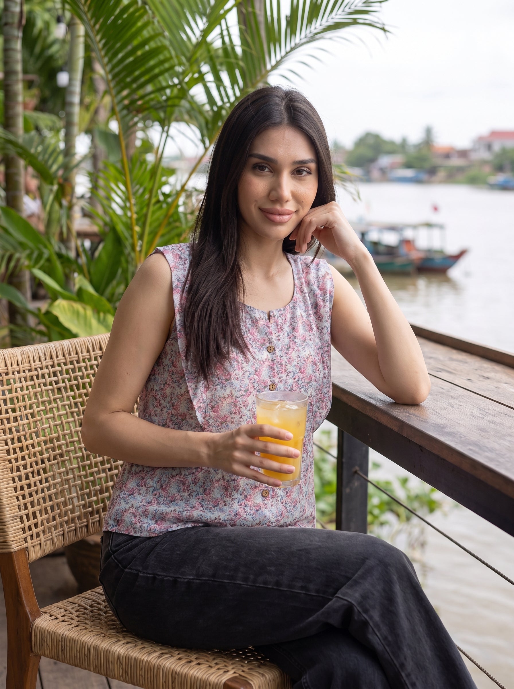 A soft lavender sleeveless top featuring delicate pink and blue mini florals for a fresh feminine look. 