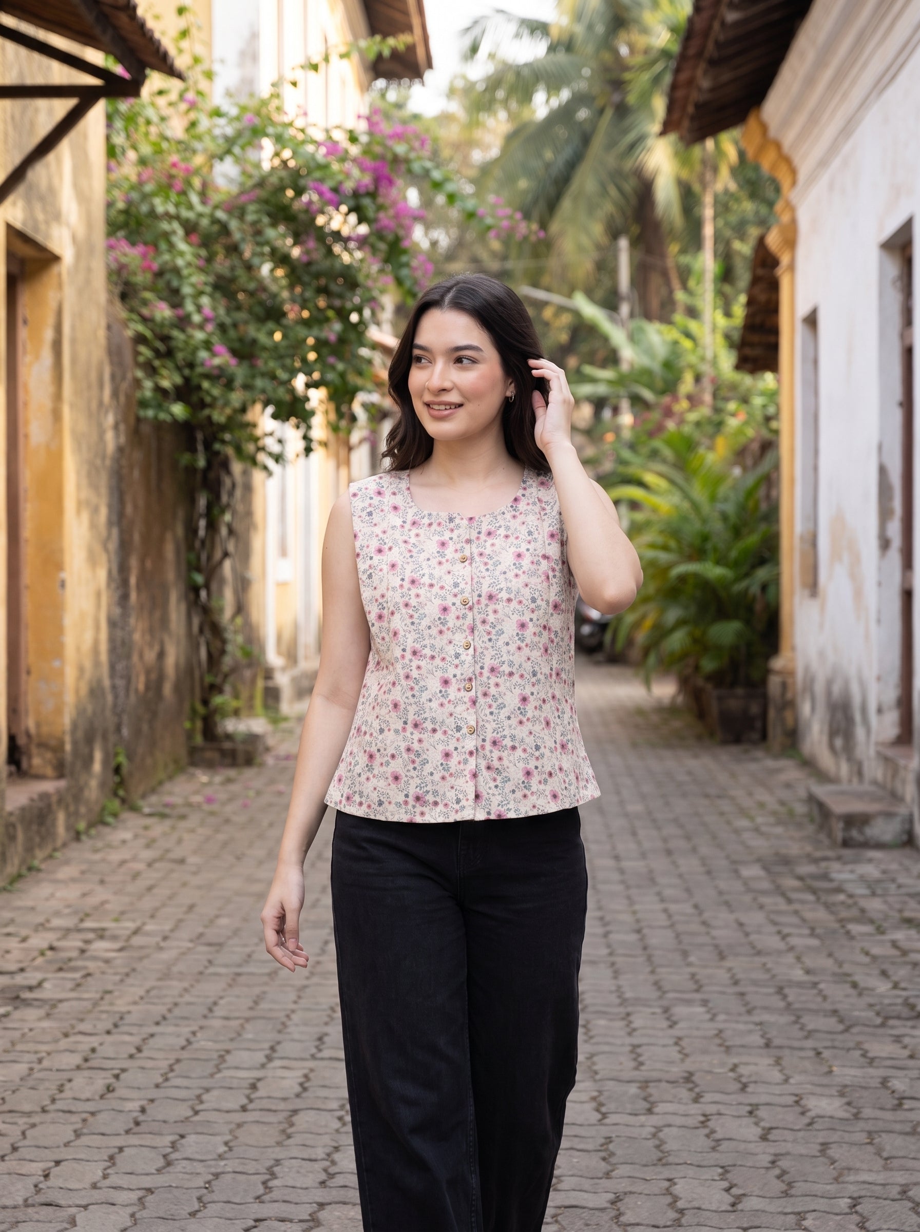 A charming Beige sleeveless top featuring delicate pink mini florals with subtle grey and green botanical accents for a soft feminine look. 