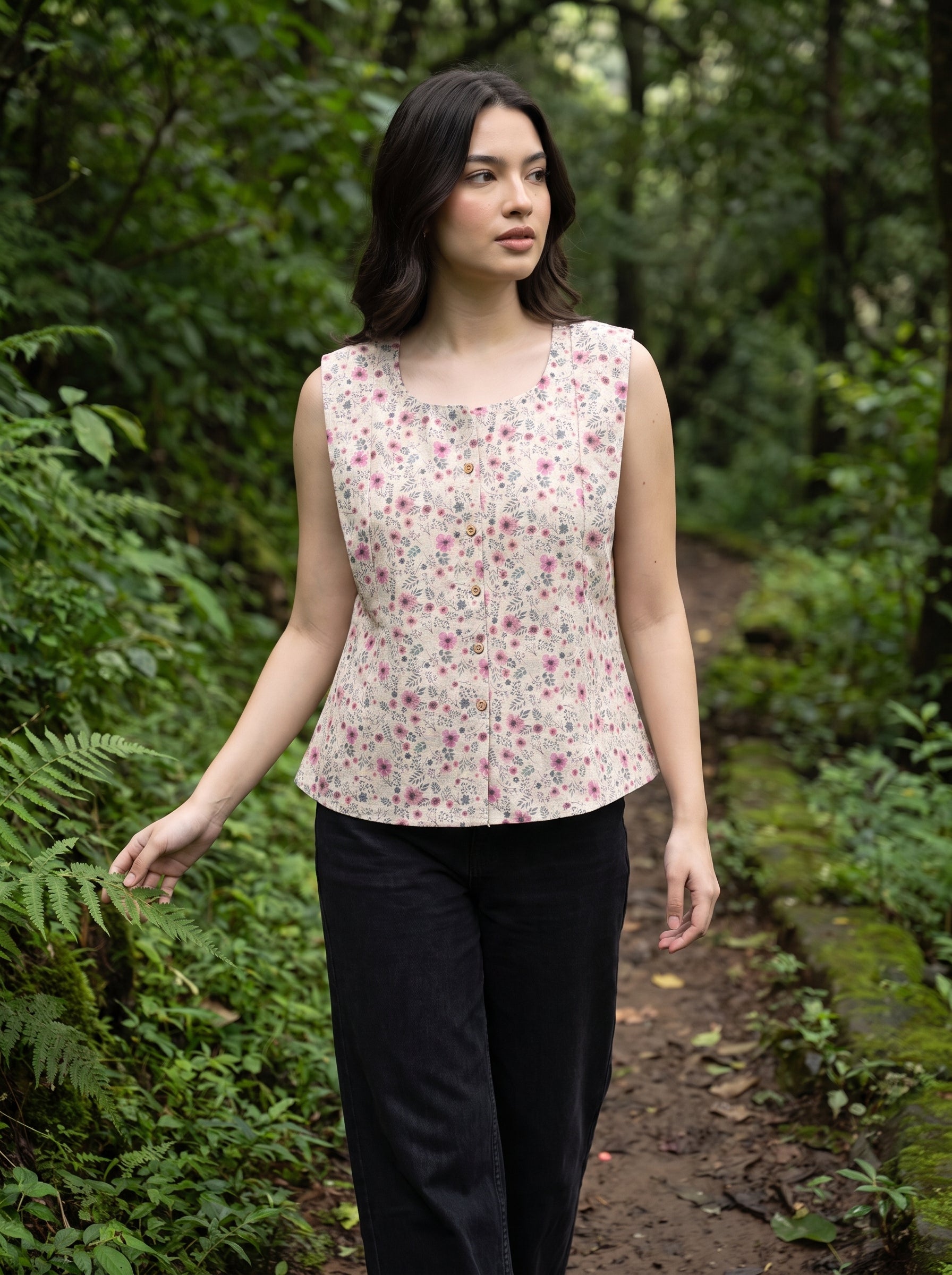 A charming Beige sleeveless top featuring delicate pink mini florals with subtle grey and green botanical accents for a soft feminine look.  