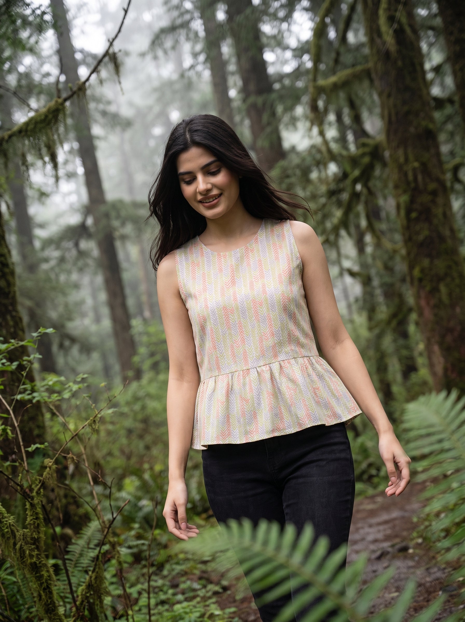 A fresh off-white sleeveless top featuring a soft pastel chevron print in peach, green, lavender, and yellow tones