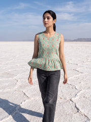  A stylish mint green sleeveless top featuring an elegant ethnic-inspired teardrop motif print all over. 