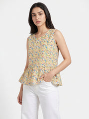 A fresh Multicolor sleeveless top featuring colorful geometric triangle motifs in blue, red, green, and orange tones. 