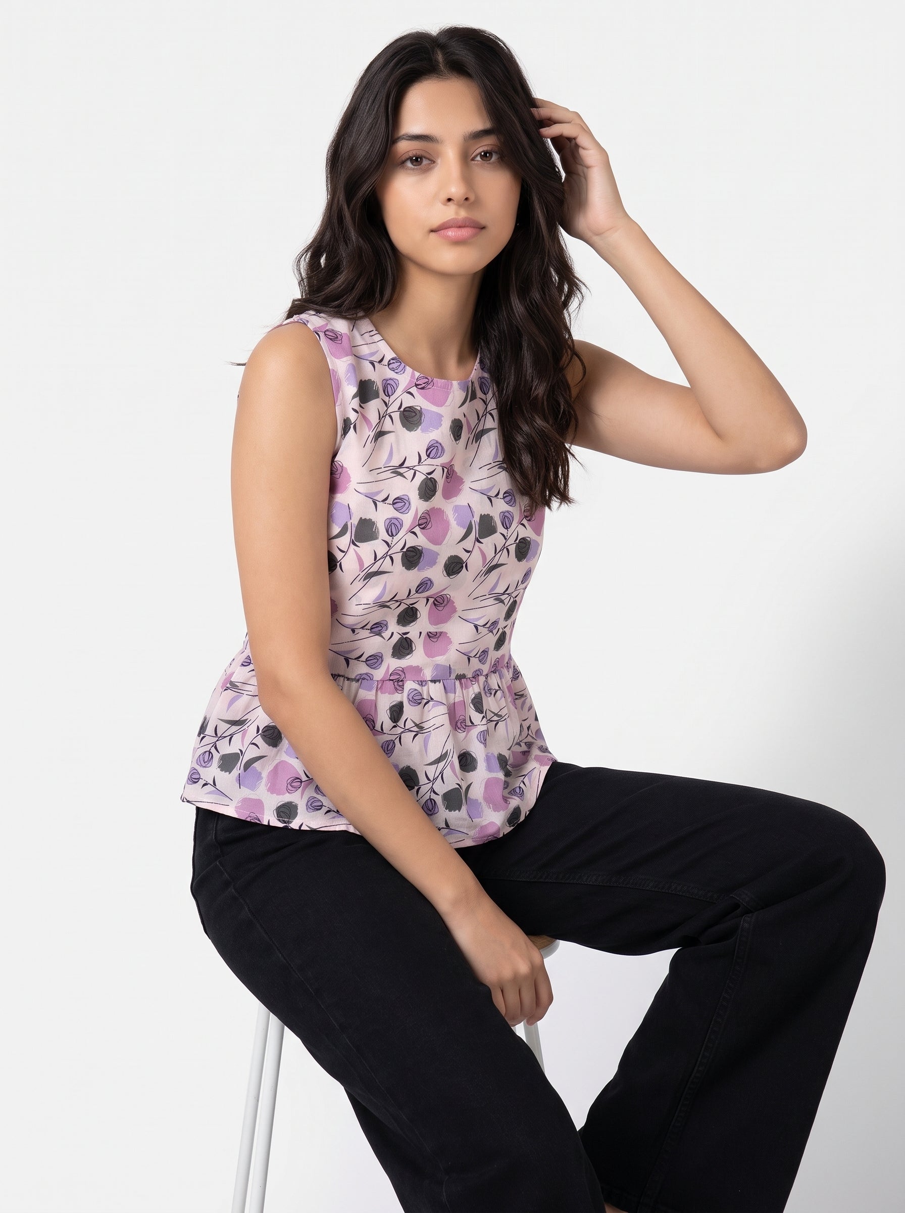 A soft light pink sleeveless top featuring lavender and black rose motifs with artistic botanical accents for a modern feminine look.