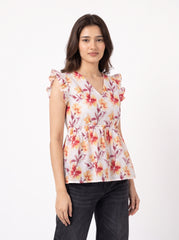 A fresh off-white top featuring rich rust, orange, and burgundy floral motifs for a warm feminine look. 