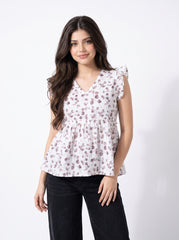 A soft off-white top featuring delicate mauve leaf motifs for a clean and feminine everyday look.